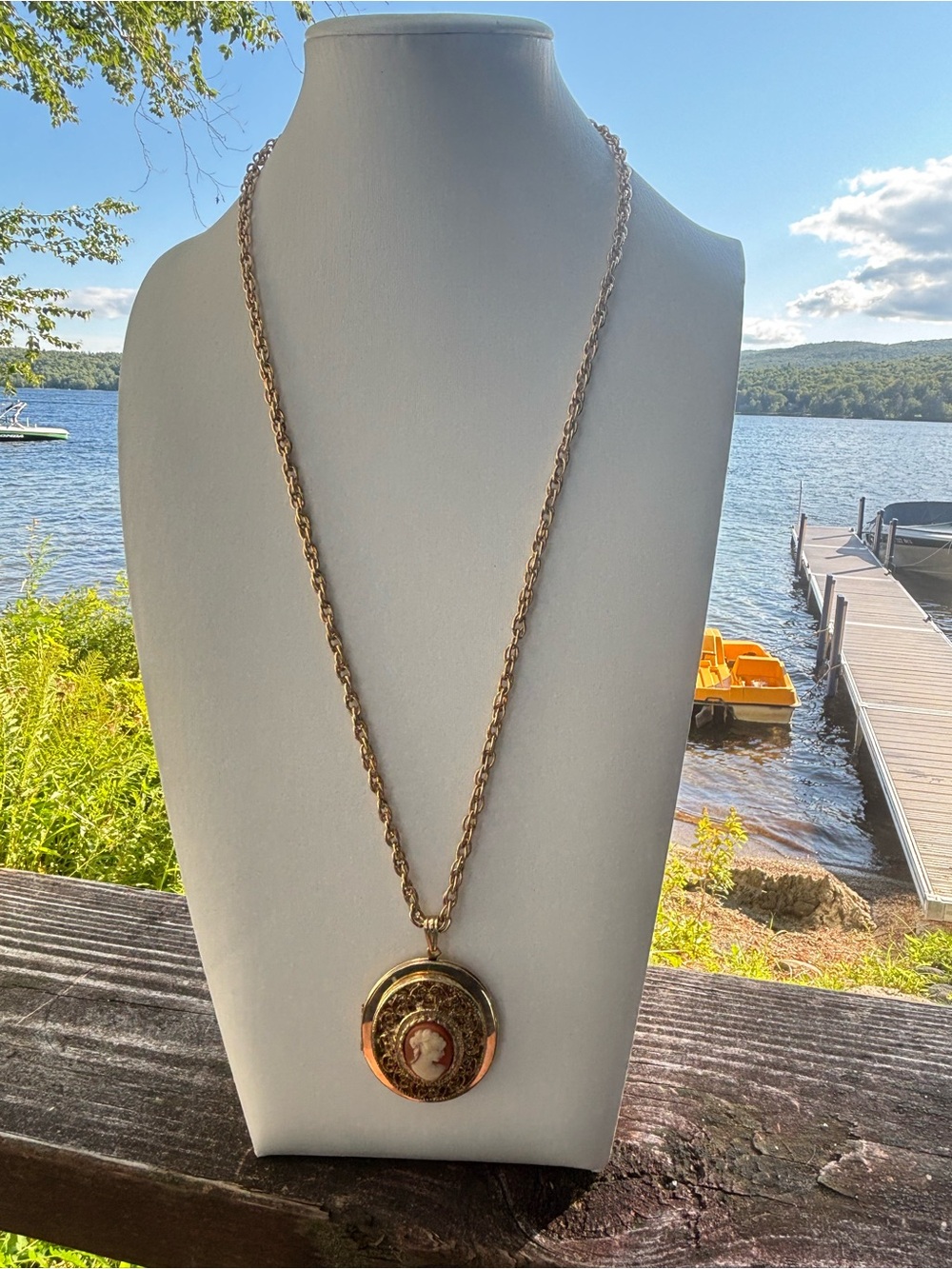 Victorian style Vintage Cameo locket Necklace with a gold tone filegree frame